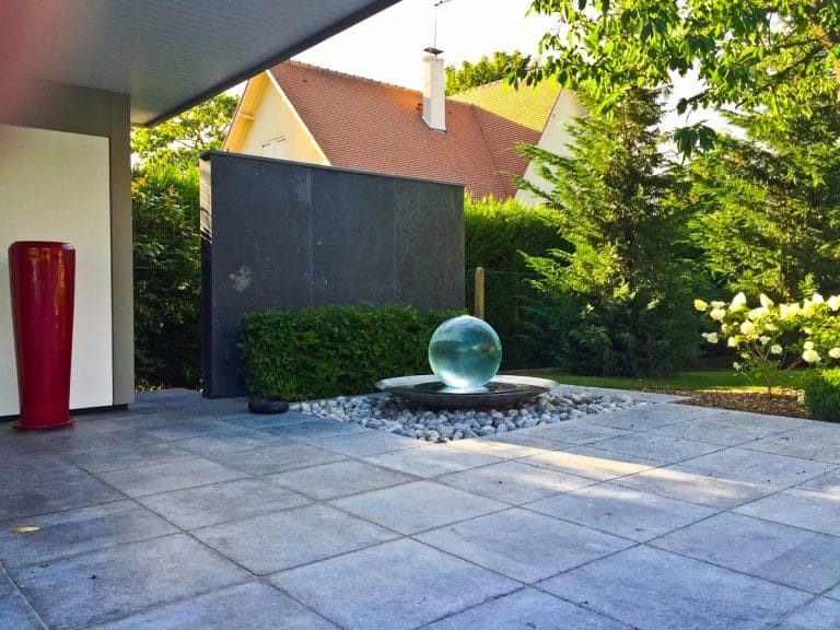 Fountain against wall in garden