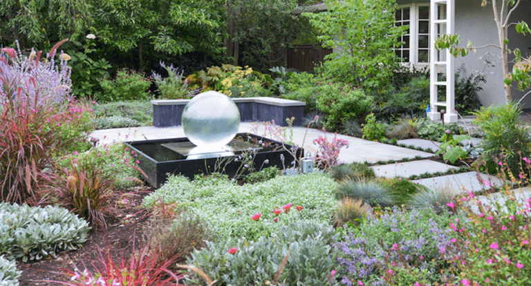 Aquasphere Orb Fountain set in lovely garden