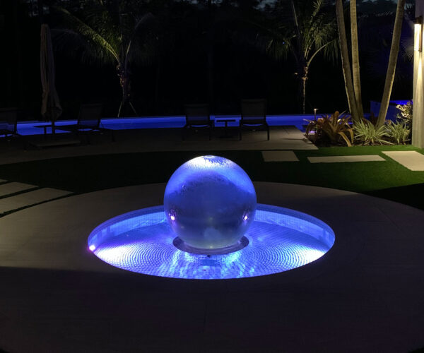 Lighted Sphere Fountain at Night