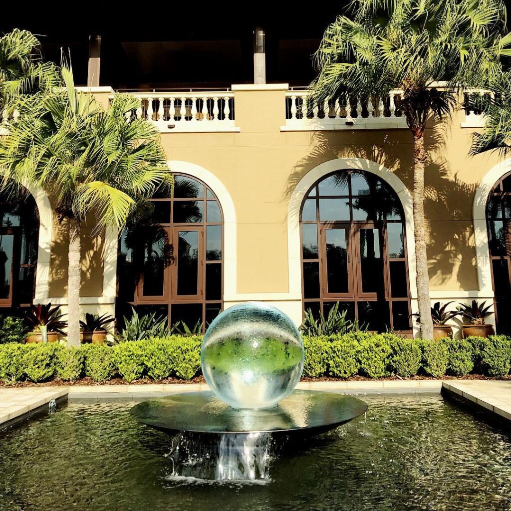 Allison-armour-sphere-fountain fountain and palms