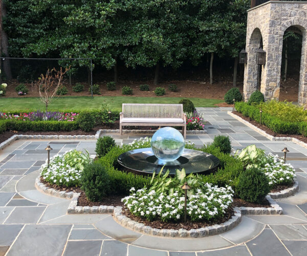 Aqualens Sphere Fountain set in a patio